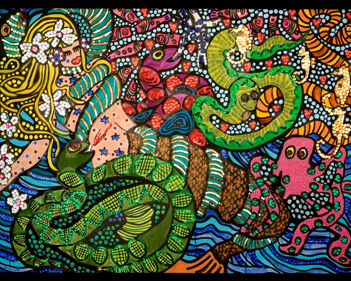 Mermaid wrapped in sea snakes
